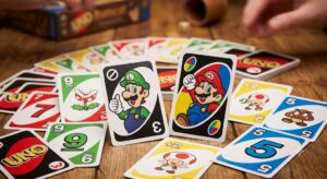 A vibrant close-up of Uno Super Mario cards spread out on a table featuring Mario and Luigi character designs.